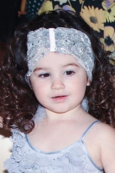 Little girl wearing a sequin headwrap