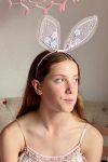 girl wearing a tulle pink bunny ears headband