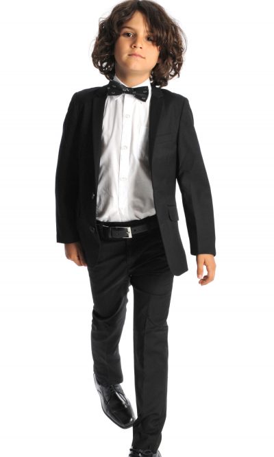 Kid in a black formal suit with white shirt and bow tie